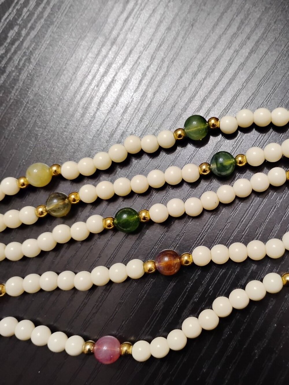 Vintage five strand necklace with translucent accent beads, gold-toned spacers